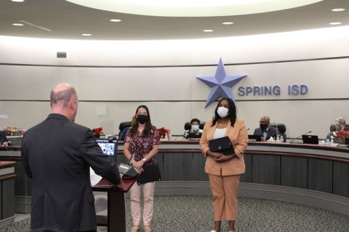 Spring ISD trustees Carmen Correa, left, and Natasha McDaniel are sworn in on Dec. 14 after being re-elected to the school board. (Emily Lincke/Community Impact Newspaper)