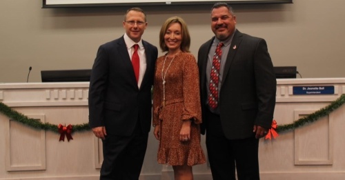 Judson ISD Superintendent Jeanette Ball poses with coaches Robert Irvin (left) and Mark Soto at the Dec. 16 JISD school board meeting. Irvin was promoted to Veterans Memorial High School’s athletic coordinator and head football coach. Soto, a Judson High School alum, was hired as JHS athletic coordinator and head football coach. (Courtesy Judson ISD)