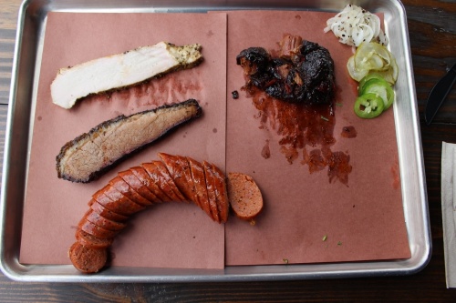 Bexar Barbecue's meats are smoked in large rotisserie smokers over pelleted post oak wood for up to 22 hours. (Chandler France/Community Impact Newspaper)