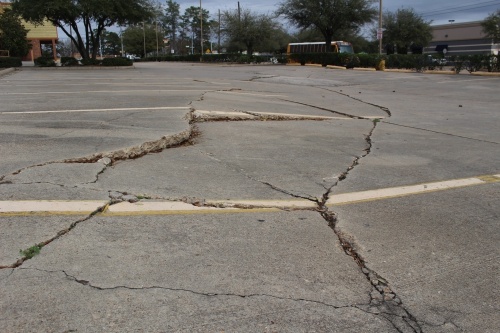 Excessive groundwater use from aquifers can lead to subsidence, or sinking of the earth, which can exacerbate the activity of fault lines. Fault lines criss-cross Montgomery County, including this one at the corner of Sgt. Ed. Holcomb Blvd. N. and Hwy. 105 in Conroe. (Eva Vigh, Community Impact Newspaper)