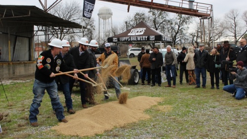 Tupps owners toss beer grains with shovels