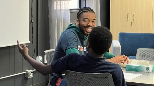 mentor smiling at student
