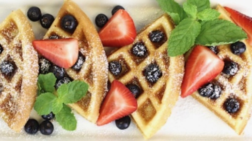 waffles with strawberries and blueberries on top