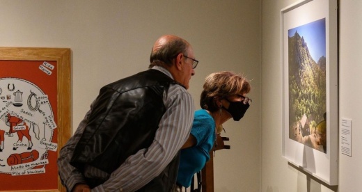 Visitors view an image in Briscoe Western Art Museum's photo exhibit, “Vaqueros de la Cruz del Diablo,” which ends Jan. 23. (Courtesy Briscoe Western Art Museum)