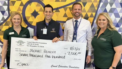 Teacher Michael Herrera at Pieper High School was surprised when he was awarded a Comal Education Foundation grant of $7,500 for the zSpace program. Pictured from left are: Sarah Permenter, Comal Education Foundation’s district liaison; Herrera; PHS Principal Jaime Alvarez-Calderon; and Chlesea Ormond, Comal Education Foundation’s executive director. (Courtesy Comal ISD)