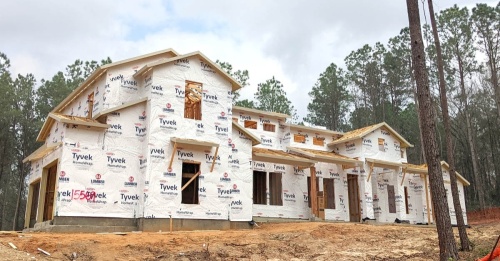 Model homes are under construction at Republic Grand Ranch, a 5,000-acre custom home community in Willis with more than 500 lots already sold. (Anna Lotz/Community Impact Newspaper)