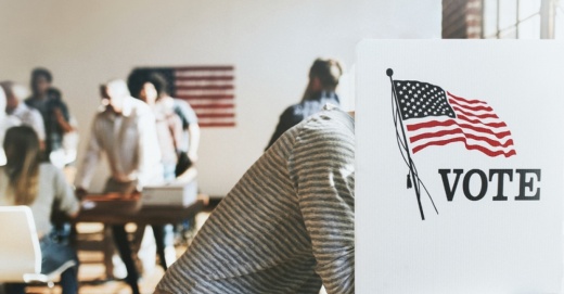 Person voting in a booth