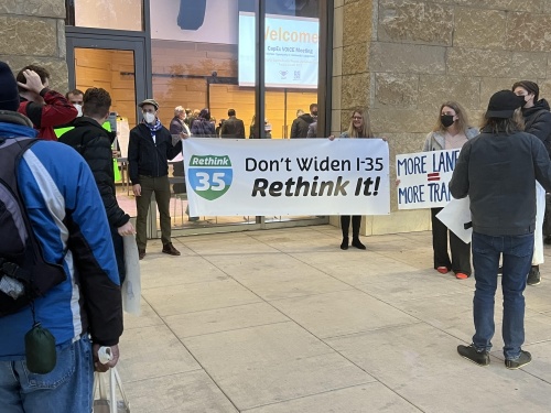 Members of Rethink35 hold a protest outside of the Jan. 25th CapEx Volunteer Opportunity in Community Engagement meeting. (Zacharia Washington/Community Impact Newspaper)