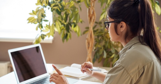 girl looking at computer screen