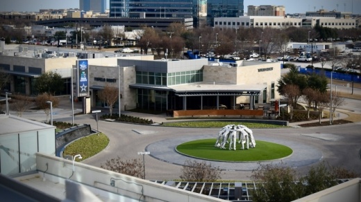 New restaurants and entertainment concepts will join existing restaurants such as Tupelo Honey around the main promenade where the Huddle sculpture is located, as pictured. Meanwhile, a new office tower is being built. (Matt Payne/Community Impact Newspaper)