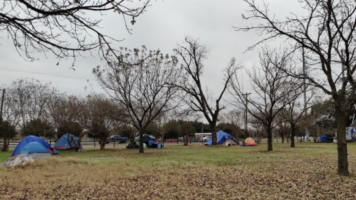 Dozens of tents line the Ann and Roy Butler Hike and Bike Trail and South Pleasant Valley Road. (Ben Thompson/Community Impact Newspaper)