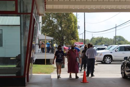 Voters wait in line to cast their ballots at Juergen's Hall Community Center in Cy-Fair in November 2020. (Shawn Arrajj/Community Impact Newspaper)