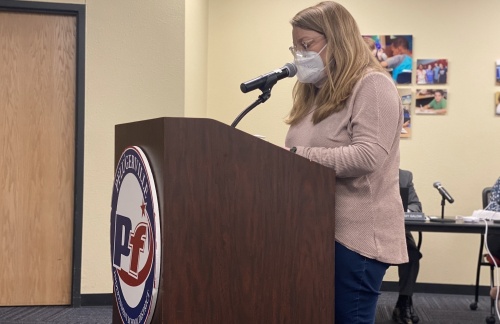 Mary Kennedy, speaking on behalf of another Pflugerville ISD employee, implored the board to compensate staff who had to miss work. (Brian Rash/Community Impact Newspaper)