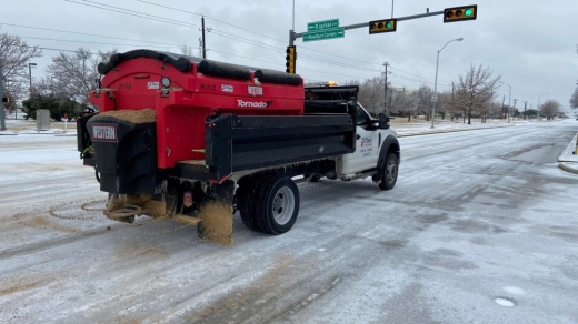 Plano vehicle sanding a street.