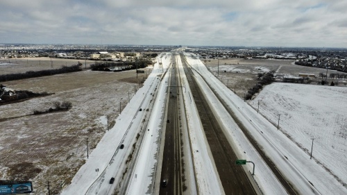 Snow and ice that was accumulated on Feb. 3-4 surround a highway in Frisco. On Feb. 23, another wave of winter weather fell across the region. (Courtesy Chris Brock)