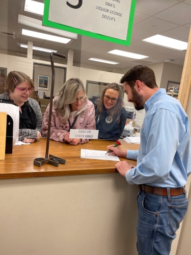 Mason Parish, a director with the Montgomery County Farm Bureau, registers his personal brand at the county clerk's office. (Courtesy Mason Parish)