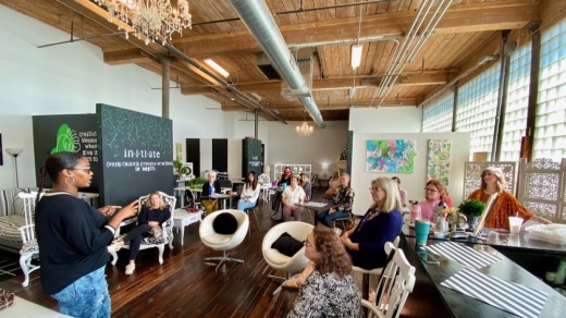 audience listening to woman speaking