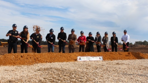 Tomball officials gathered with Lovett Industrial for the ground breaking ceremony on March 9. (Anna Lotz/Community Impact Newspaper)