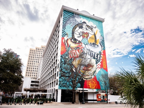 Residents can tour several downtown Austin murals on a bike ride March 12, including one by Canadian artist Sandra Chevrier and Shepard Fairey, American street artist and graphic designer, on the side of The LINE on Congress Avenue. (Courtesy Jay Ybarra)