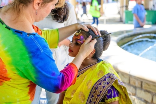 girl getting face painted