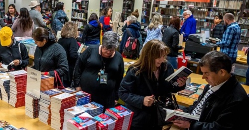 Attendees of the 2018 San Antonio Book Festival wait to pay for their books. The 10th annual book festival returns as an in-person event May 21 for the first time since 2019. (Courtesy San Antonio Book Festival)