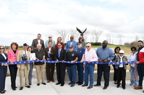 Sugar Land City Council members, Sugar Land Legacy Foundation members, veterans and donors unveil the second phase of the city's Eagle Plaza. (Hunter Marrow/Community Impact Newspaper)