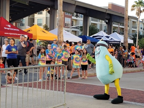Peary watches the runners at 2019’s Pear Run. (Courtesy Heather Baker)