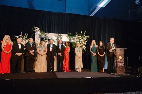 From left, Interfaith President and CEO Missy Herndon, U.S. Rep. Kevin Brady, Walt Lisiewski, Paula Klapesky, Tim Welbes, Justin Kendrick, Ketrese White, Linda Nelson, Nicole Murphy, DeAnn Guidry and Bruce Tough appear at the gala honoring Hometown Heroes. (Courtesy Interfaith of The Woodlands)