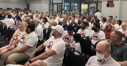 More than 200 people showed up for Flower Mound's Planning and Zoning Commission meeting. Many had to stand in the town hall entry way as seats were full in the council chambers. (Samantha Douty/ Community Impact Newspaper)