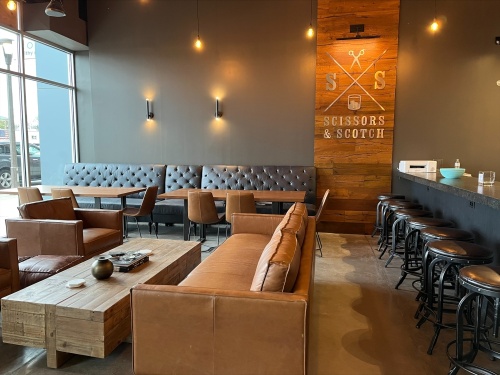 Scissors & Scotch, a barbershop and spa with a full bar, will have a soft opening at McEwen Northside from April 13-16. (Courtesy Scissors & Scotch)