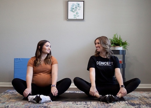 Dr. Stefanie Long stretching with a client