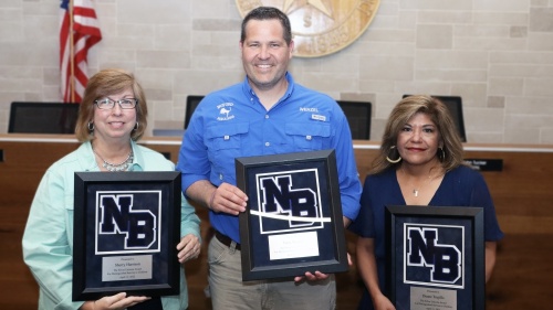 From left, Sherry Harrison, Trent Wenzel and Cynthia Trujillo accepted the 2022 Silver Unicorn Awards. (Courtesy NBISD)
