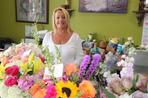 Shea Freeman has been owner of Freeman's Flowers and Gifts for over 18 years. (Alana Thomas/Community Impact Newspaper)