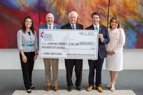 San Antonio-based Methodist Healthcare Ministries of South Texas on May 3 donates $250,000 to the Housing First Community Coalition to support HFCC’s Towne Twin Village project. From left are MHMST Chief Operating Officer Xochy Hurtado, MHMST board Chair Dr. Michael Lane, HFCC board Chair Mark Wittig, MHMST President & CEO Jaime Wesolowski, and Christine Yanas, MHMST's vice president of policy and advocacy. (Courtesy Methodist Healthcare Ministries of South Texas)