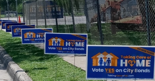 Pro-city of San Antonio bond campaign signs line a street near Bradley Middle School. San Antonio voters approved all six propositions in the city's $1.2 billion bond May 7. (Edmond Ortiz/Community Impact Newspaper)