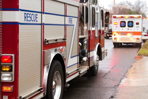 Fire truck and ambulance on side of road
