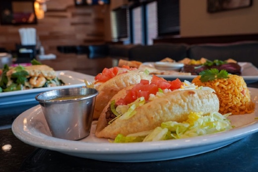 Tavo's Puffy Tacos ($13-$16) is named after late owner Gustavo Hernandez (Christopher Goodwin/Community Impact Newspaper)
