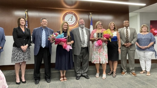 From left: AISD board members Regan Peterson, David Selsky, Nicole Tonini, Earl Humbird, Tiffany Wennerstrom, Carol Nelson, Albert "AJ" Johnson and Cheryl Harris bid farewell to departing colleagues. (Andy Yanez/Community Impact Newspaper)