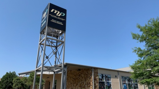 Michael Johnson Performance sign and building