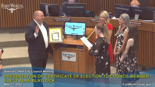 Alan Blaylock takes the oath of office with his family in attendance at the Fort Worth City Council meeting on May 17. (Screenshot courtesy city of Fort Worth)