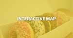 text that reads Interactive Map over a translucent yellow background with a photo of donuts