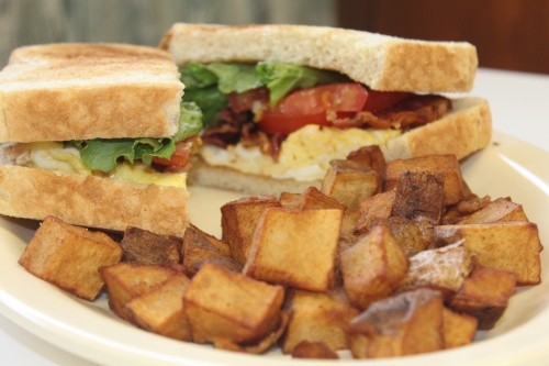 bacon, egg, lettuce and tomato sandwich on sourdough bread 