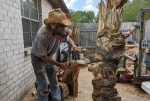 Jimmy Phillips carves his work out of his Clear Lake home. (Jake Magee/Community Impact Newspaper)