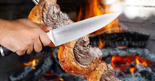 The restaurant will serve a variety of different steak cuts vertically on large skewers. (Courtesy Adobe Stock)