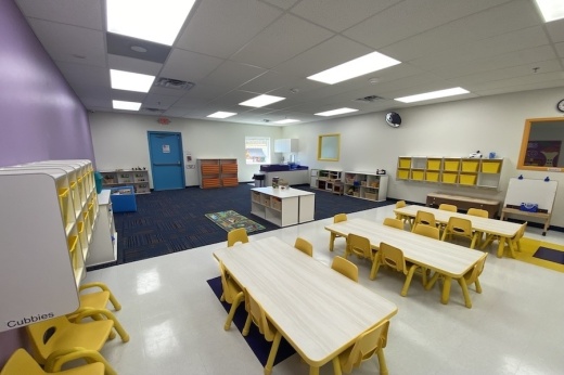 Preschool classroom with tables and chairs