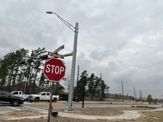 A stop sign at the intersection of Rayford Road and Birnham Woods Drive