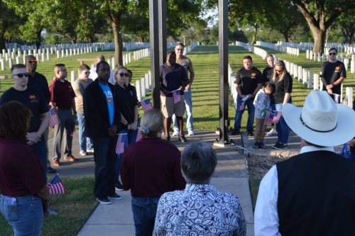 Soldiers, cadre and family members from Brooke Army Medical Center’s Soldier Recovery Unit participate in a memorial walk May 26 at the Fort Sam Houston National Cemetery. The cemetery will host Memorial Day observances this holiday weekend, including various organizations laying flags on headstones as part of the nationwide Flags for Fallen Vets initiative. (Courtesy Brooke Army Medical Center)