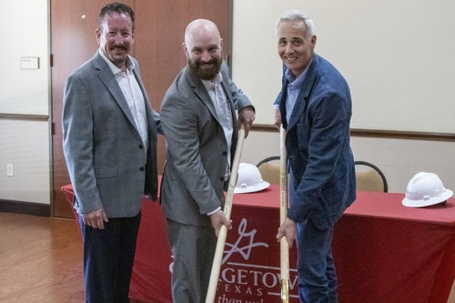 From left, Ubiquity Operations Managing Director Patrick O'Leary; Greg Dial, Ubiquity chief revenue officer and managing director; and Georgetown Mayor Josh Schroeder broke ground on a new open-access fiber system May 24 in Sun City. (Courtesy city of Georgetown)