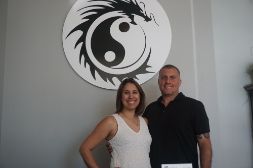 Rachel Groschke and Steven Villanueva Skees co-own Yoga Dragon and instruct classes. (Mikah Boyd/Community Impact Newspaper)