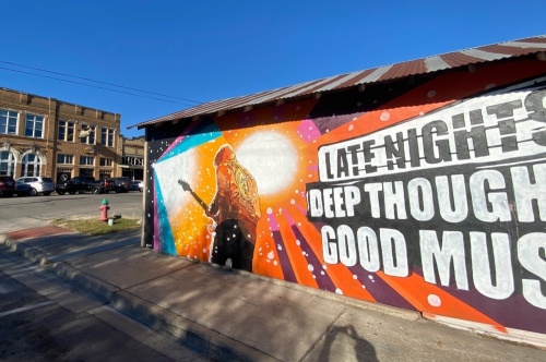 Photo of a mural depicting Jimi Hendrix along with the words "Late Nights, Deep Thoughts, Good Music"